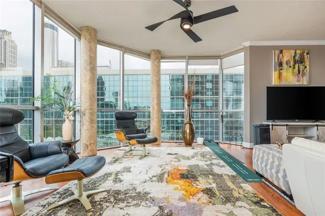 a living room with furniture and a flat screen tv