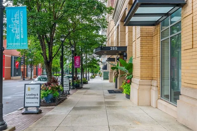 a view of a pathway with a house in the background