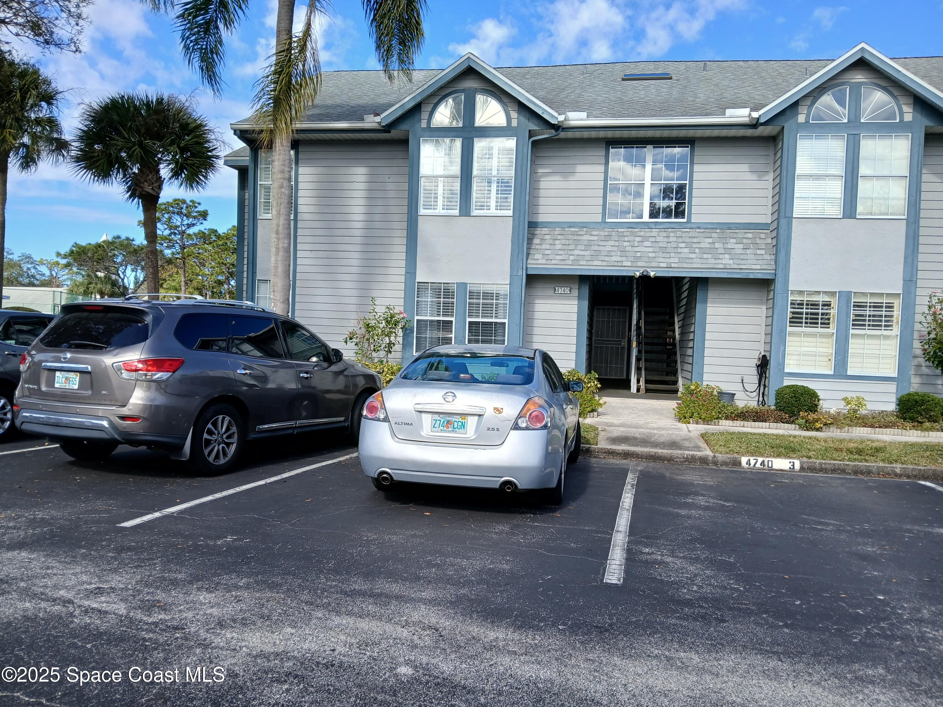 a view of a car parked in front of a house