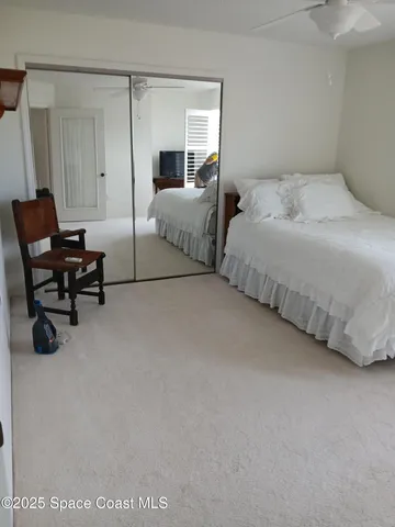 a bedroom with bed and window