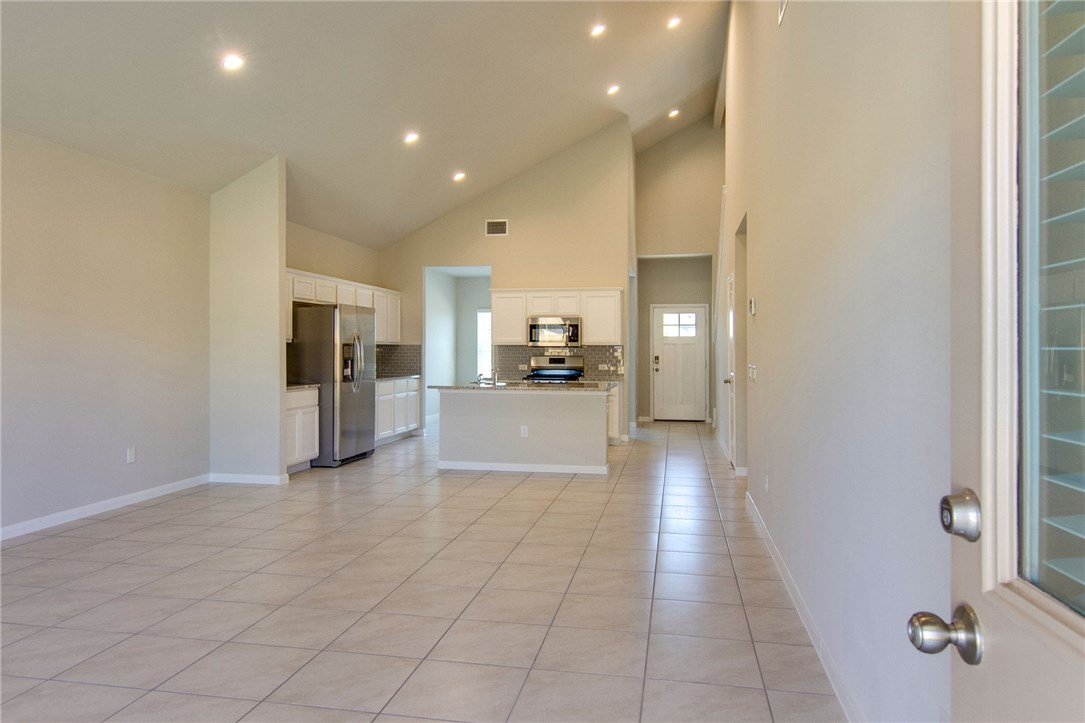 7012 Ranchito Drive Austin, TX 78744 - Photo 11 of 34 a view of a kitchen with a sink and refrigerator