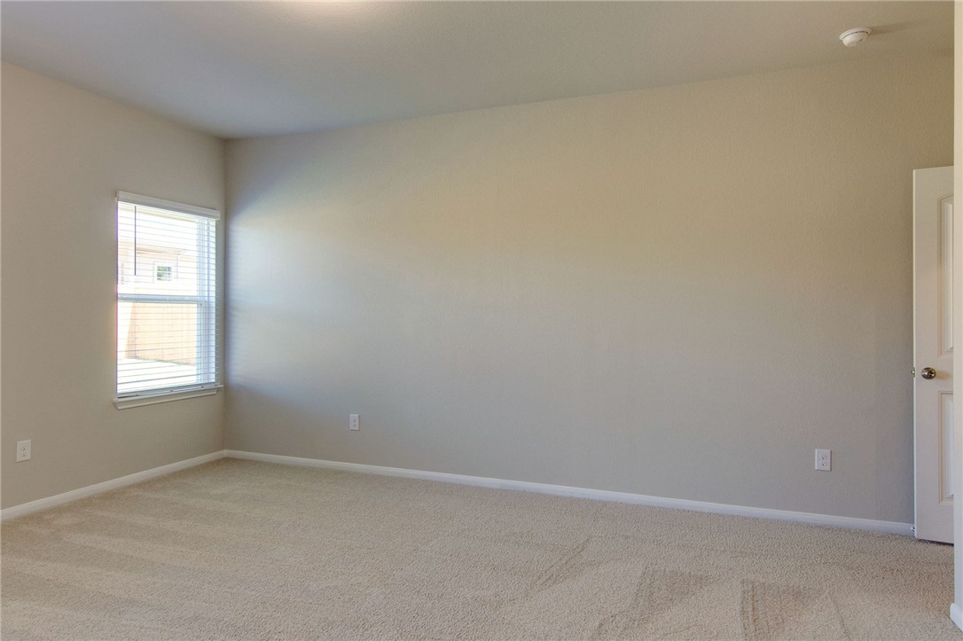 7012 Ranchito Drive Austin, TX 78744 - Photo 20 of 34 an empty room with a window