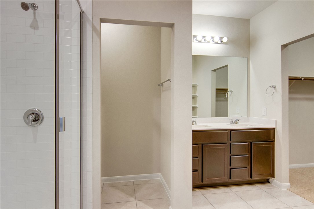 7012 Ranchito Drive Austin, TX 78744 - Photo 21 of 34 a bathroom with a sink and a mirror