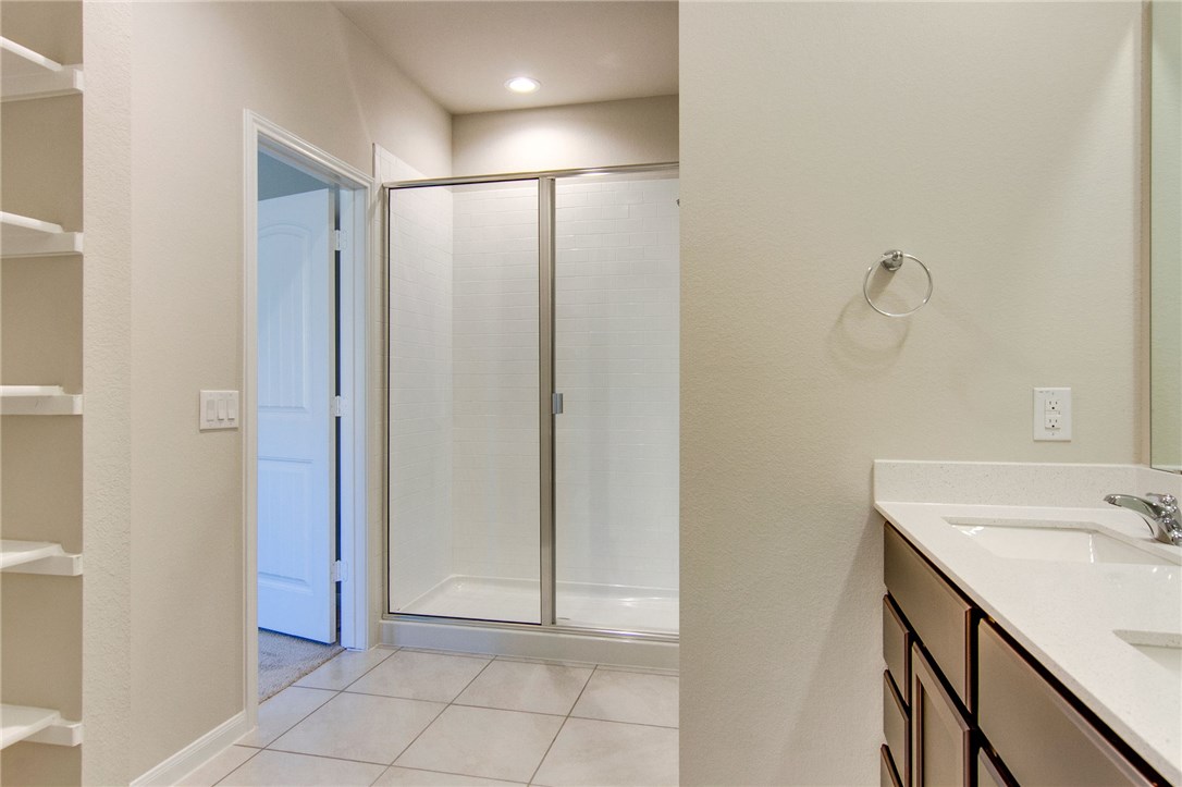 7012 Ranchito Drive Austin, TX 78744 - Photo 22 of 34 a bathroom with a sink and a mirror