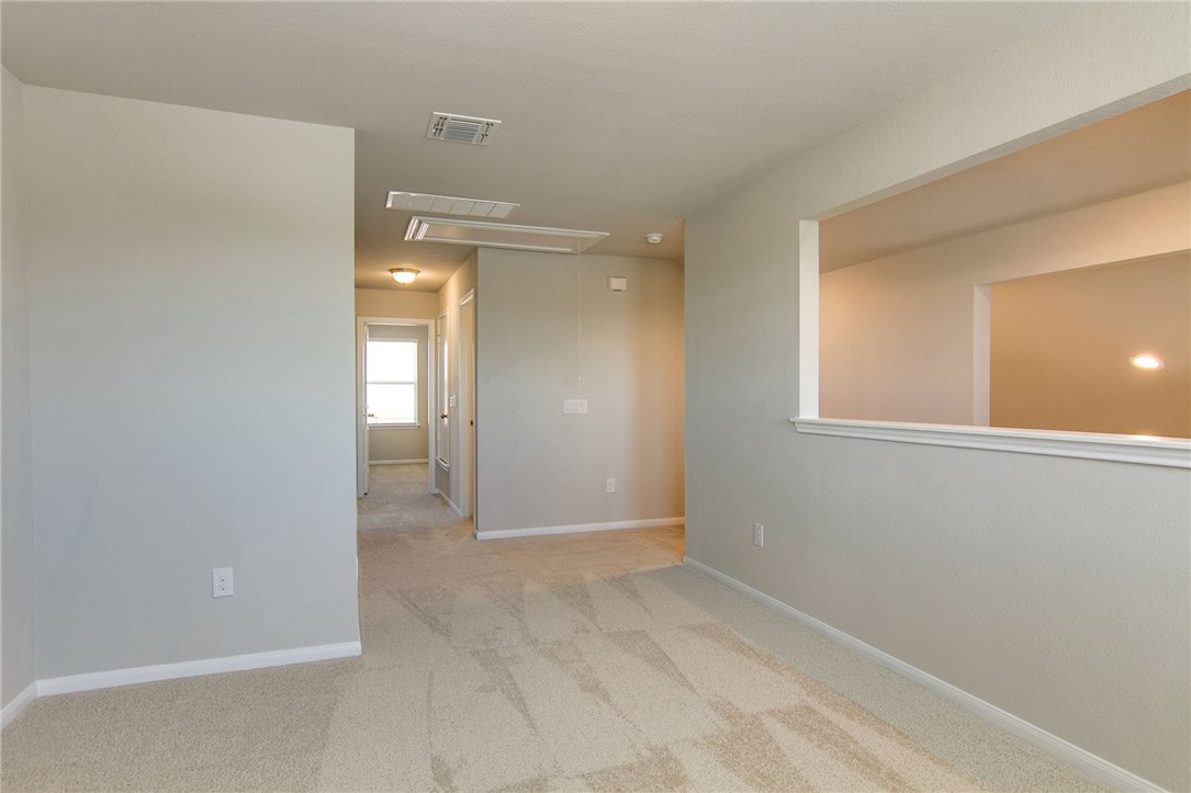 7012 Ranchito Drive Austin, TX 78744 - Photo 23 of 34 a view of an empty room with window and bathroom