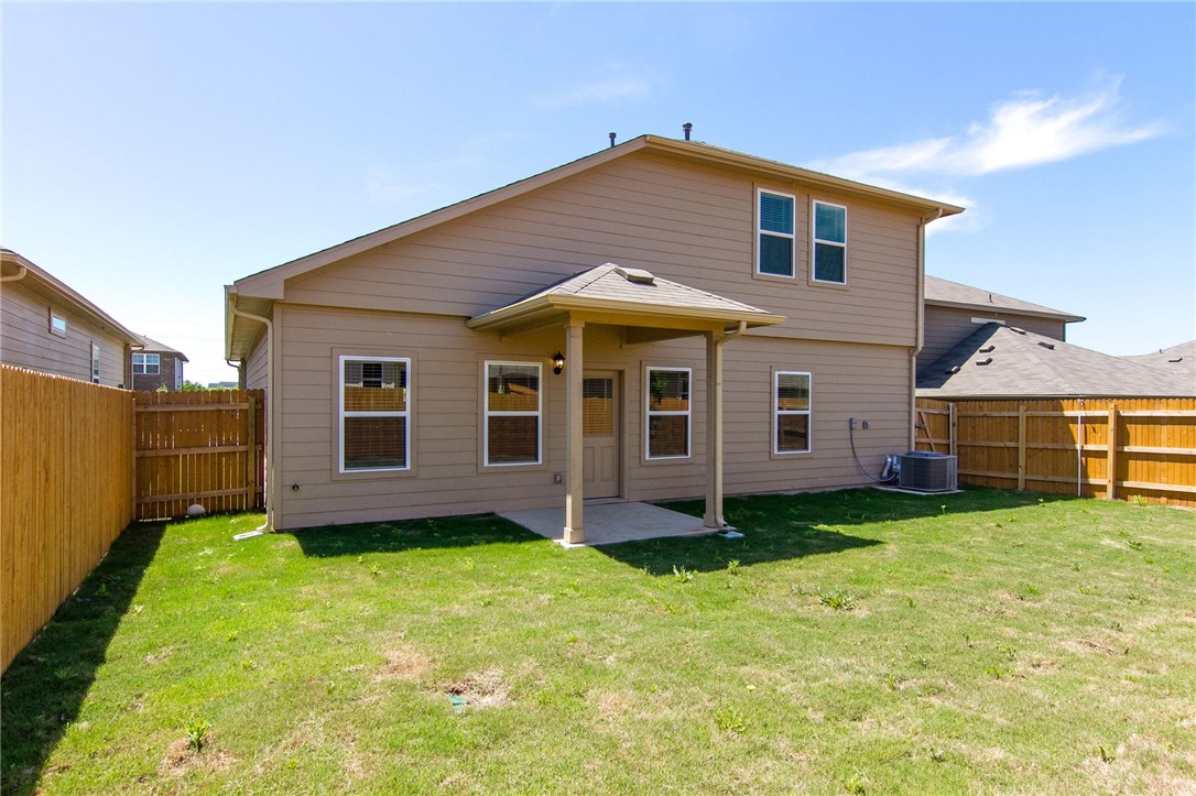 7012 Ranchito Drive Austin, TX 78744 - Photo 29 of 34 a front view of a house with a yard
