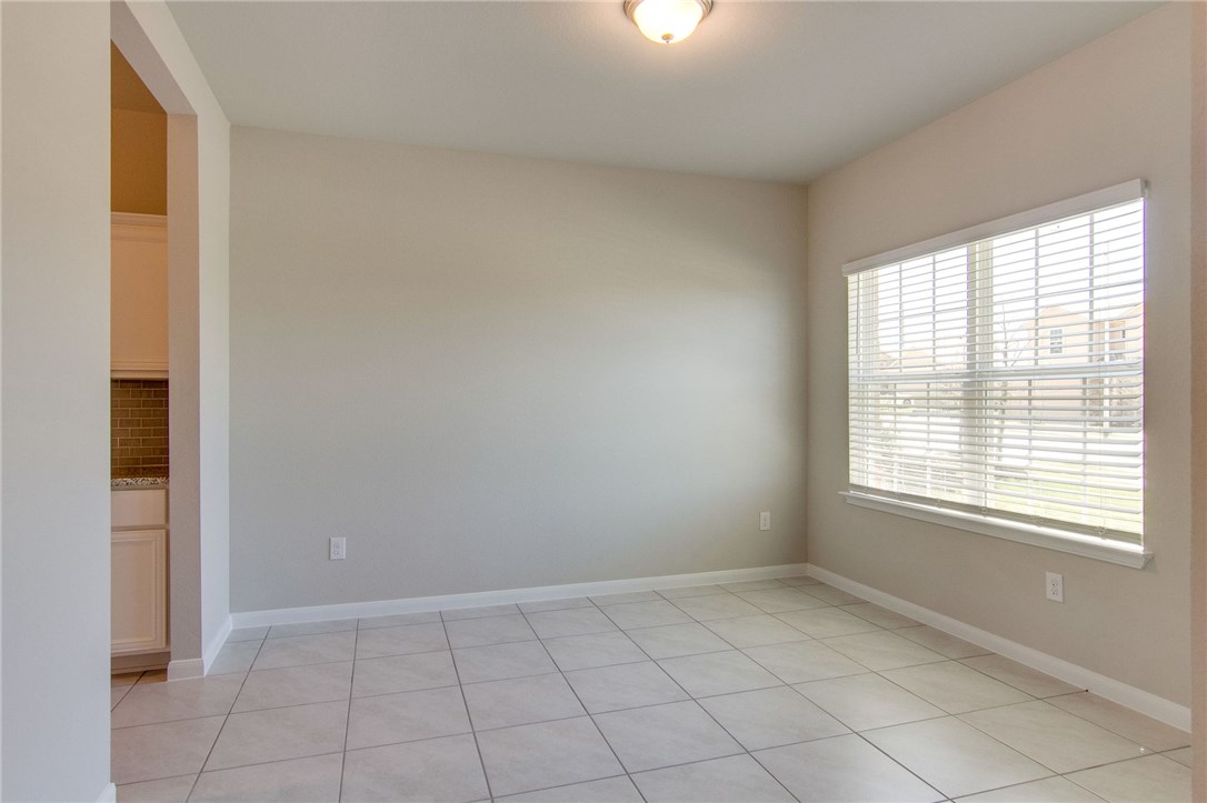 7012 Ranchito Drive Austin, TX 78744 - Photo 6 of 34 a view of an empty room with a window