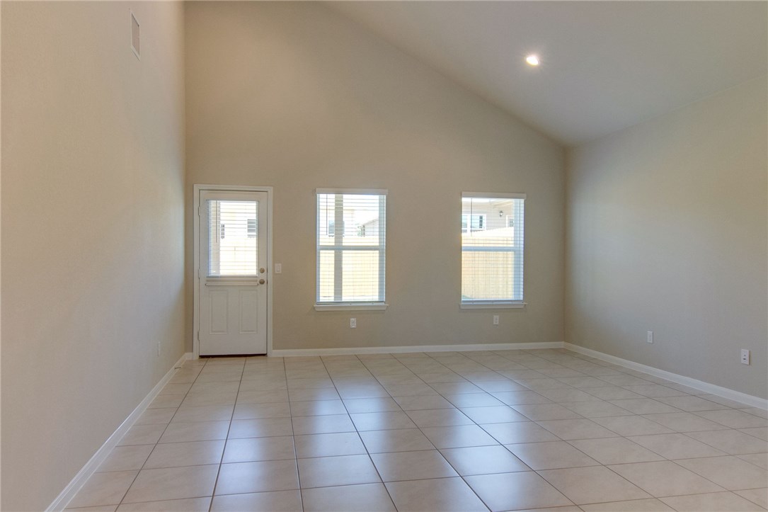 7012 Ranchito Drive Austin, TX 78744 - Photo 8 of 34 an empty room with windows