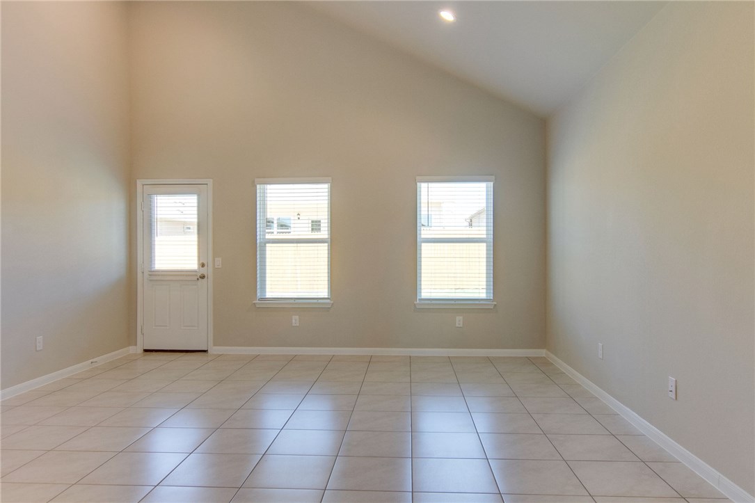 7012 Ranchito Drive Austin, TX 78744 - Photo 9 of 34 an empty room with windows