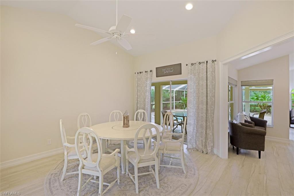 471 Ibis Way Naples, FL 34110 - Photo 14 of 32 a view of a dining room with furniture window and outside view