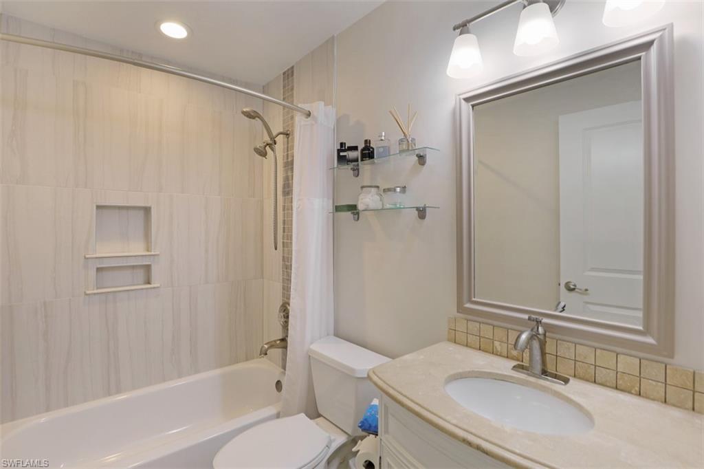 471 Ibis Way Naples, FL 34110 - Photo 22 of 32 a bathroom with a sink toilet and shower
