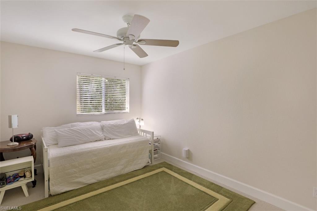 471 Ibis Way Naples, FL 34110 - Photo 24 of 32 a living room with furniture and a window