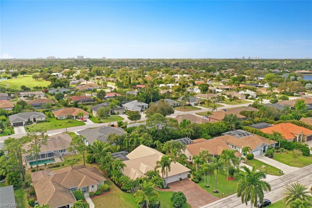 471 Ibis Way Naples, FL 34110 - Photo 28 of 32 an aerial view of residential houses with outdoor space
