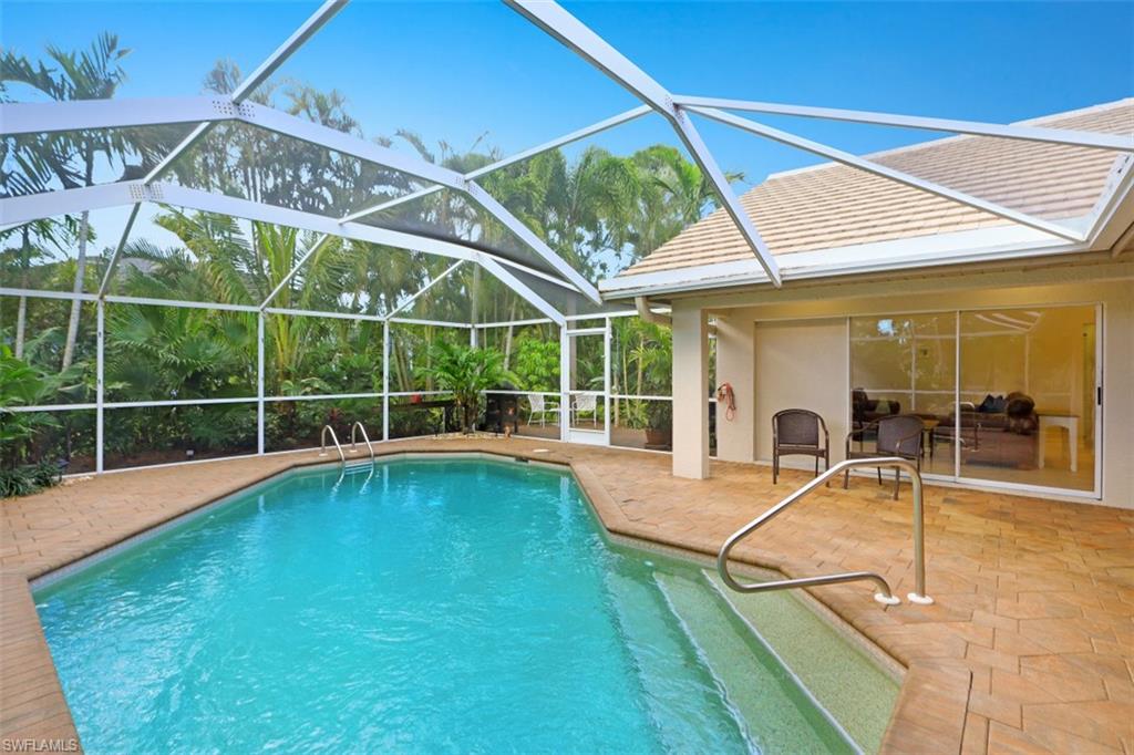 471 Ibis Way Naples, FL 34110 - Photo 30 of 32 a view of a backyard with swimming pool