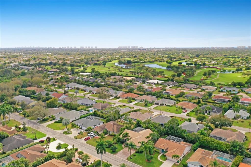 471 Ibis Way Naples, FL 34110 - Photo 31 of 32 an aerial view of multiple house