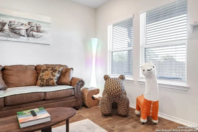 a living room with furniture and a window
