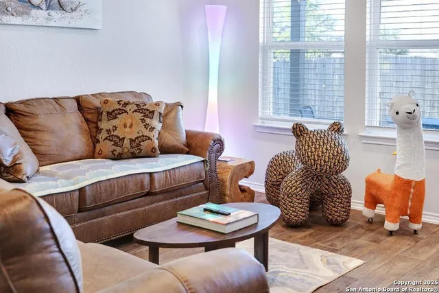 a living room with furniture and a large window