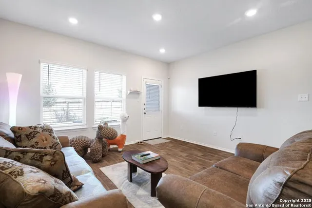 a view of backyard with wooden fence