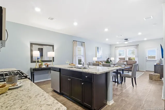 a kitchen with lots of counter top space and living room