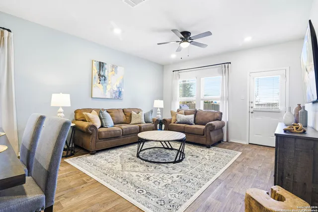 a living room with furniture and a rug