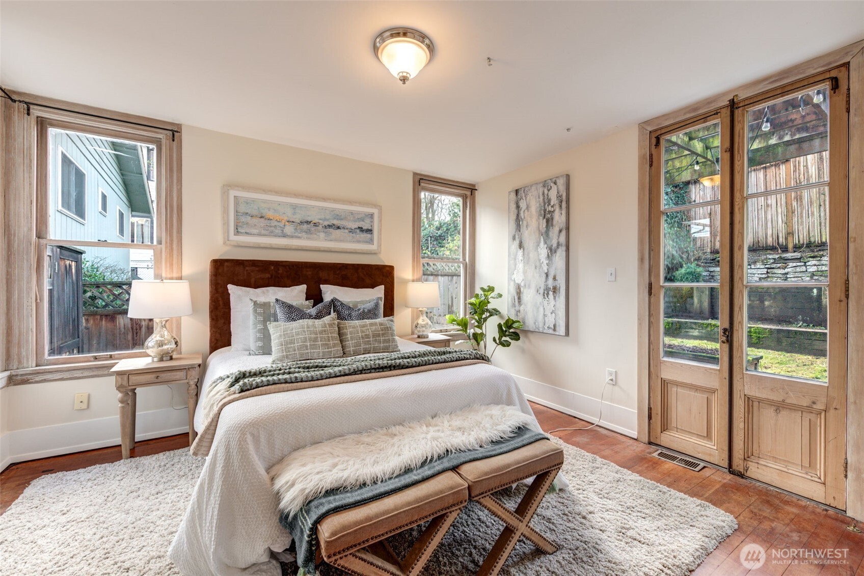 1523 35th Avenue Seattle, WA 98122 - Photo 15 of 35 a bedroom with a bed and a large window