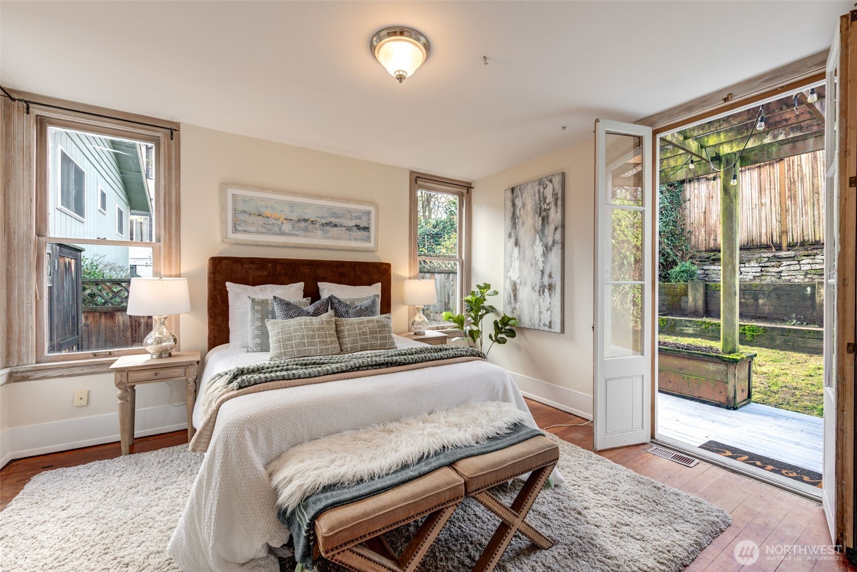 1523 35th Avenue Seattle, WA 98122 - Photo 17 of 35 a bedroom with a bed and a large window