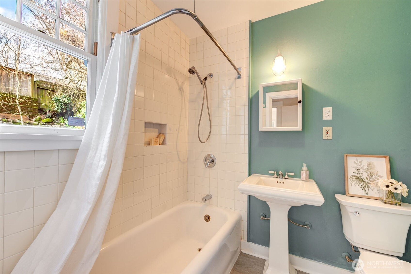 1523 35th Avenue Seattle, WA 98122 - Photo 18 of 35 a bathroom with a sink mirror toilet and bathtub