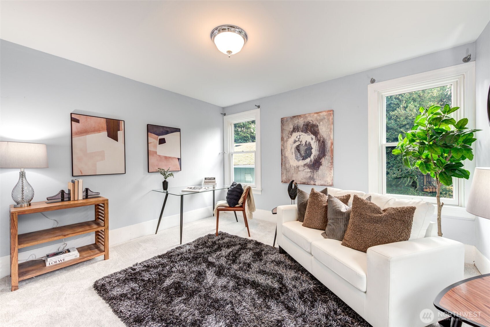 1523 35th Avenue Seattle, WA 98122 - Photo 28 of 35 a living room with furniture a rug a lamp and a window