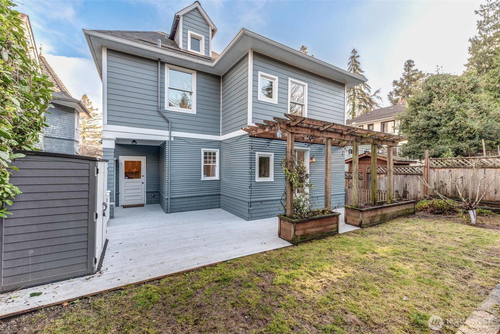 1523 35th Avenue Seattle, WA 98122 - Photo 30 of 35 a front view of a house with a yard