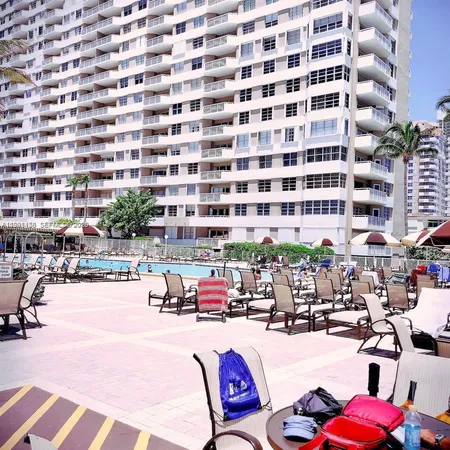 a swimming pool view with a outdoor seating