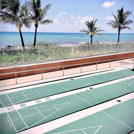 a view of swimming pool from a balcony