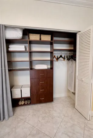 a view of a storage & utility room with racks on the wall