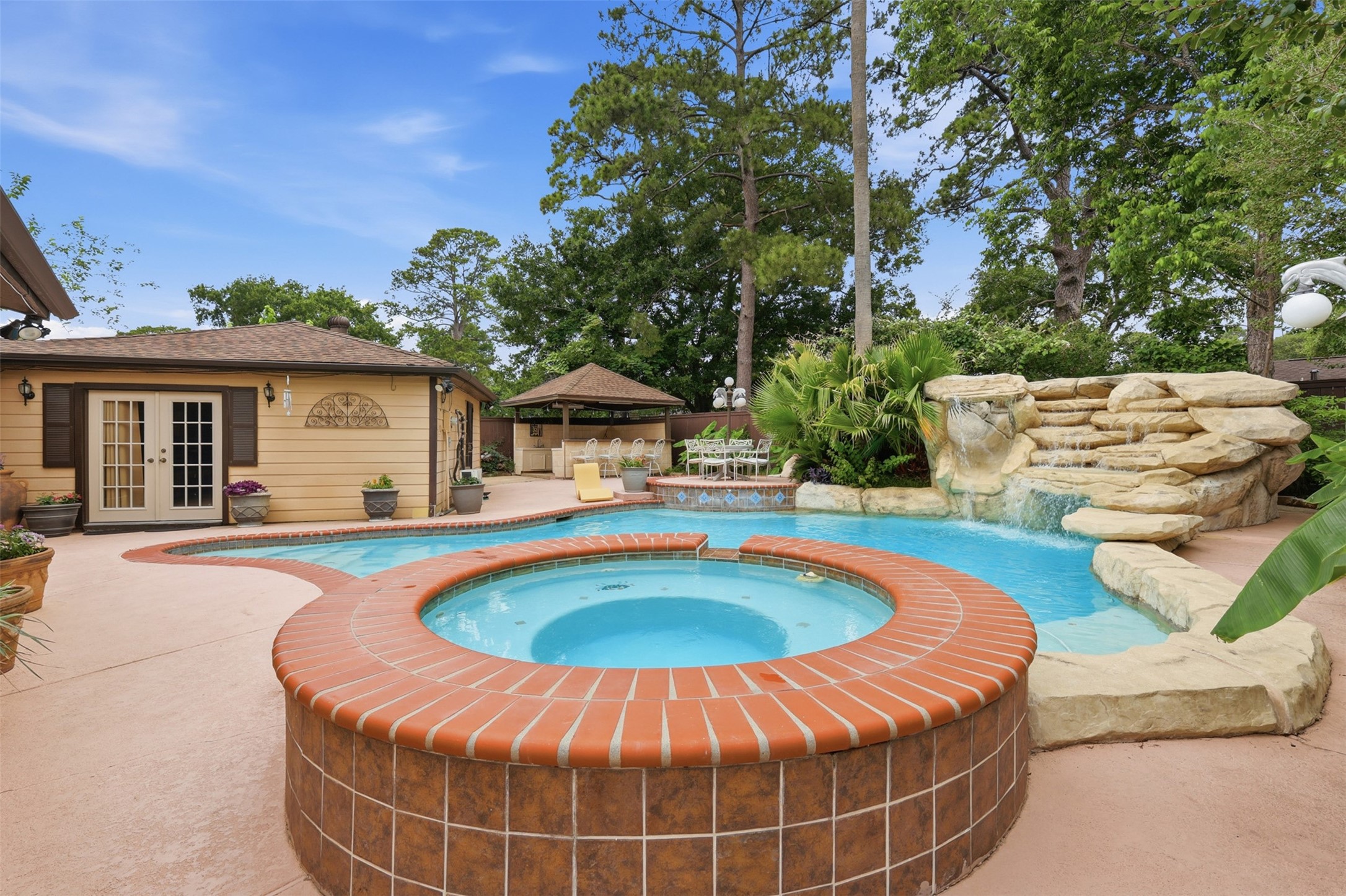 7010 River Mill Drive Spring, TX 77379 - Photo 1 of 29 a view of a house with swimming pool and sitting area