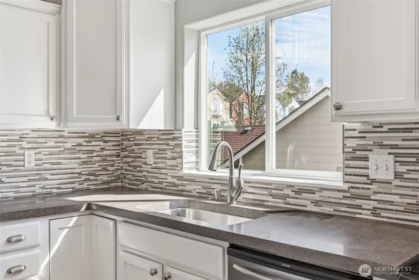 a kitchen with a sink and a window