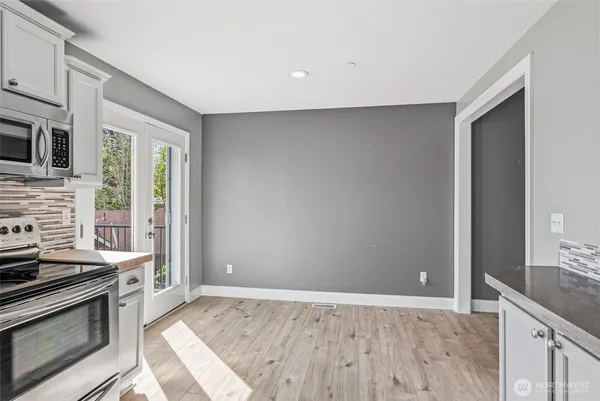 a kitchen with granite countertop a stove and a sink