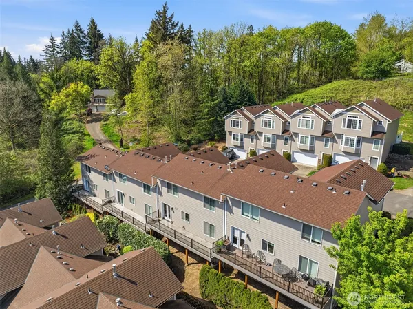 an aerial view of a house with a yard