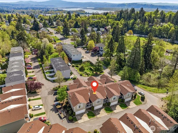 an aerial view of multiple house with yard