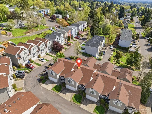 an aerial view of residential houses with outdoor space