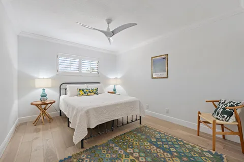 a bedroom with a bed and a table