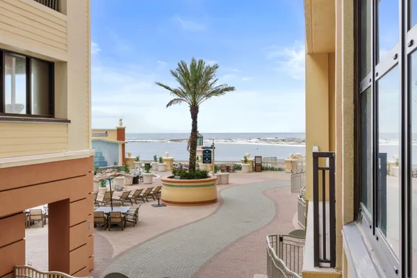 a terrace with seating area and city view