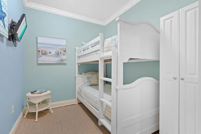 a bedroom with furniture and a window