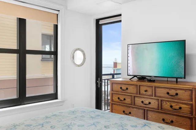 a room with furniture and flat screen tv