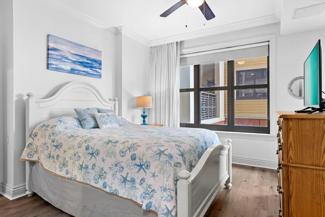 a bedroom with a large bed and a window