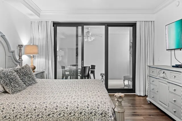 a bedroom with a large bed and a dresser