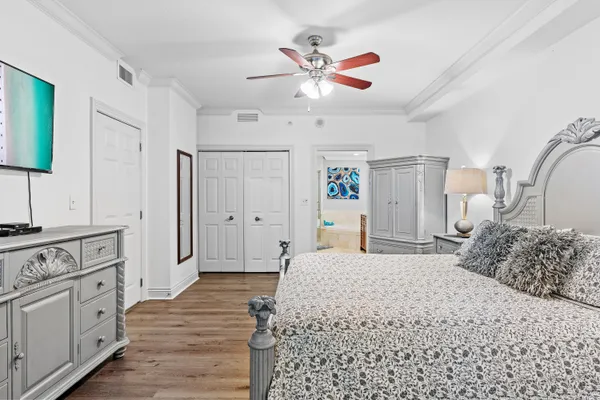 a bedroom with a bed and a cabinets