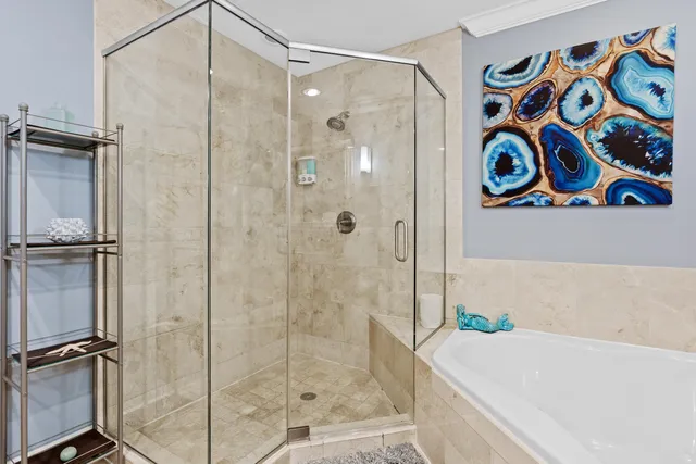 a bathroom with a shower and a sink