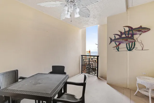 a workspace with furniture and chandelier