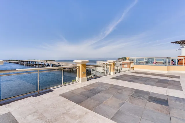 a view of a kitchen with furniture and white cabinets