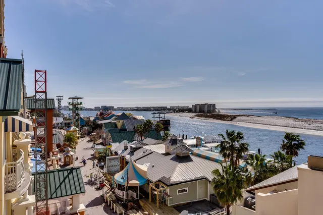 an aerial view of a house with a lake view