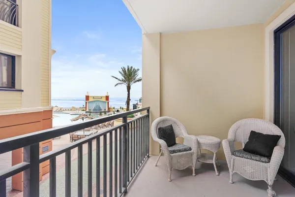 a view of a chair and table in the balcony